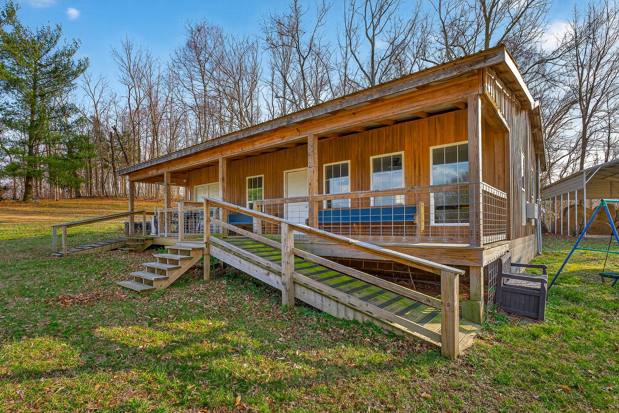 1680 Harrison Ferry Road McMinnville, TN 37110 - Photo 2 of 53 a front view of a house with a yard table and chairs