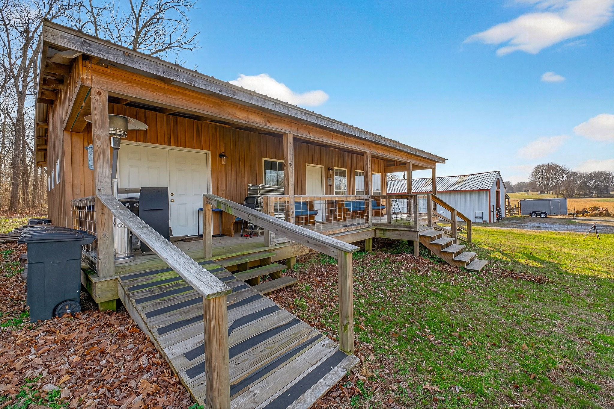 1680 Harrison Ferry Road McMinnville, TN 37110 - Photo 32 of 53 a view of a house with large trees and a small yard