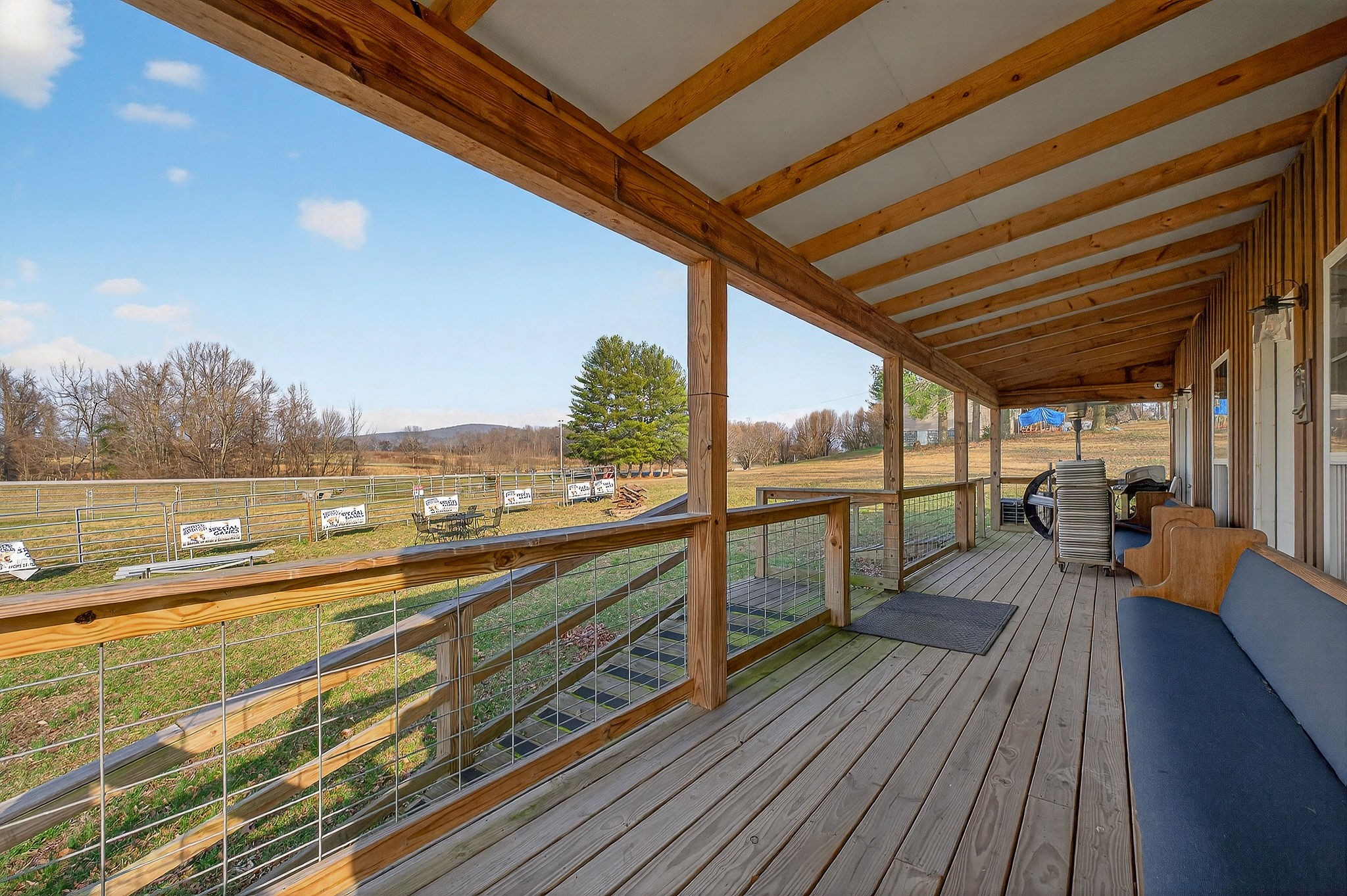 1680 Harrison Ferry Road McMinnville, TN 37110 - Photo 33 of 53 a view of balcony with couch and wooden floor