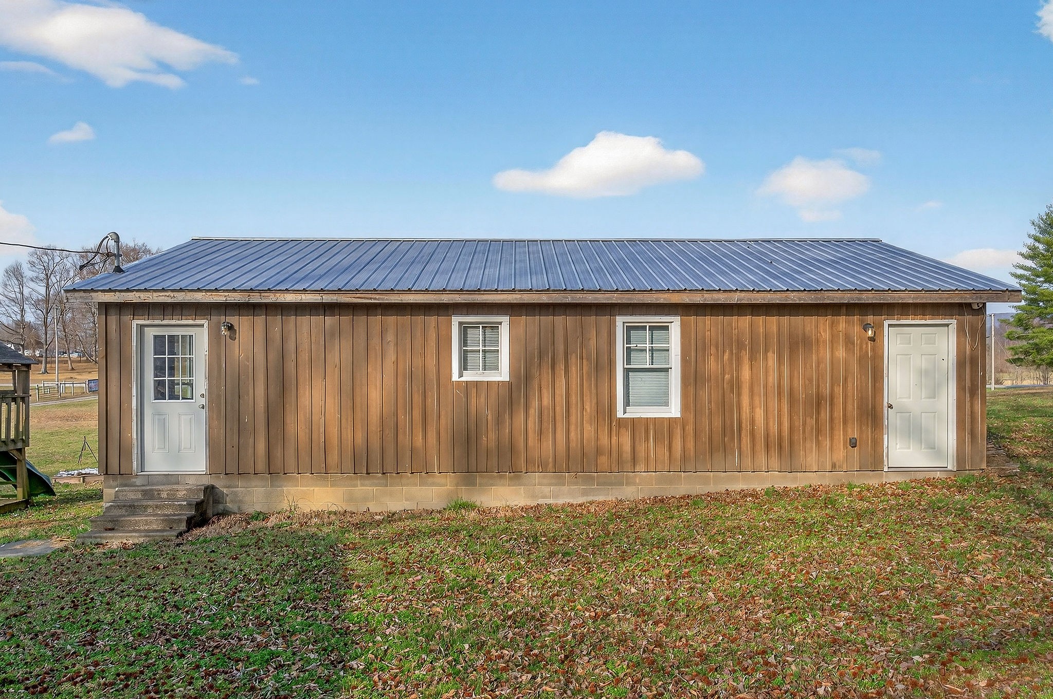 1680 Harrison Ferry Road McMinnville, TN 37110 - Photo 35 of 53 a view of a house with backyard and porch