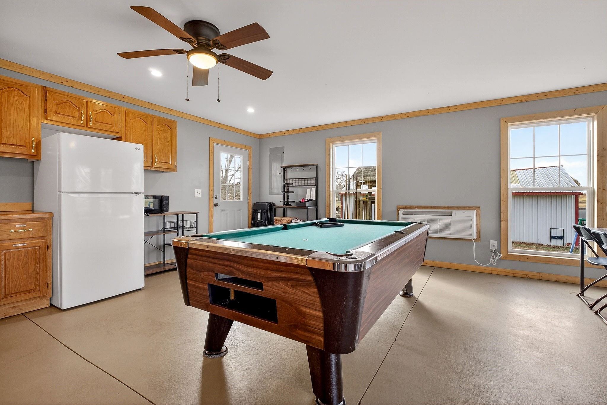 1680 Harrison Ferry Road McMinnville, TN 37110 - Photo 38 of 53 a kitchen with stainless steel appliances granite countertop a stove a refrigerator a sink a dining table and chairs with wooden floor