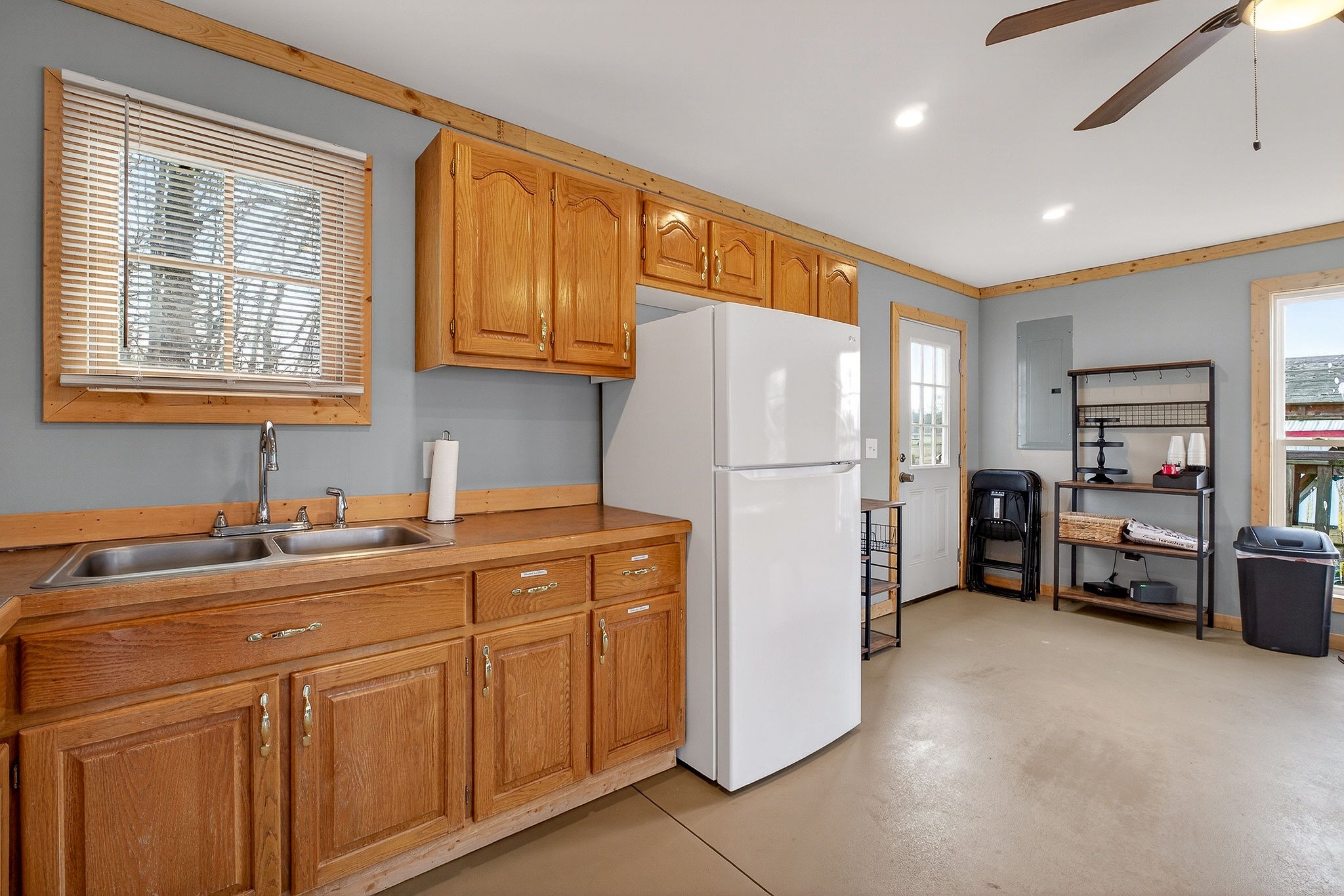 1680 Harrison Ferry Road McMinnville, TN 37110 - Photo 40 of 53 a kitchen with sink refrigerator and cabinets