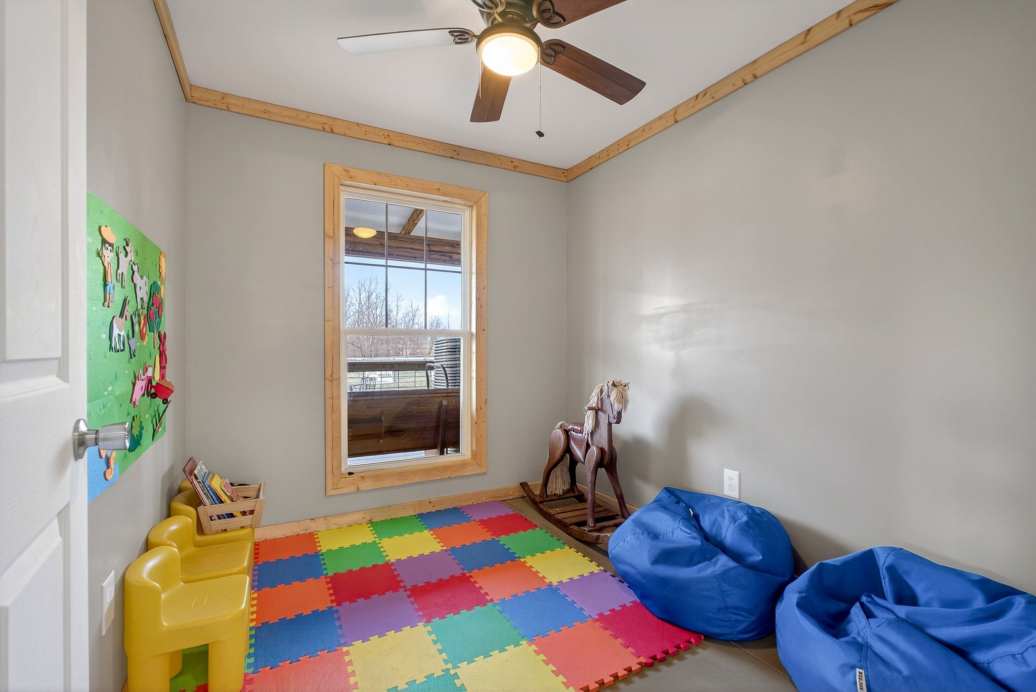 1680 Harrison Ferry Road McMinnville, TN 37110 - Photo 47 of 53 a bedroom with a bed and a chandelier