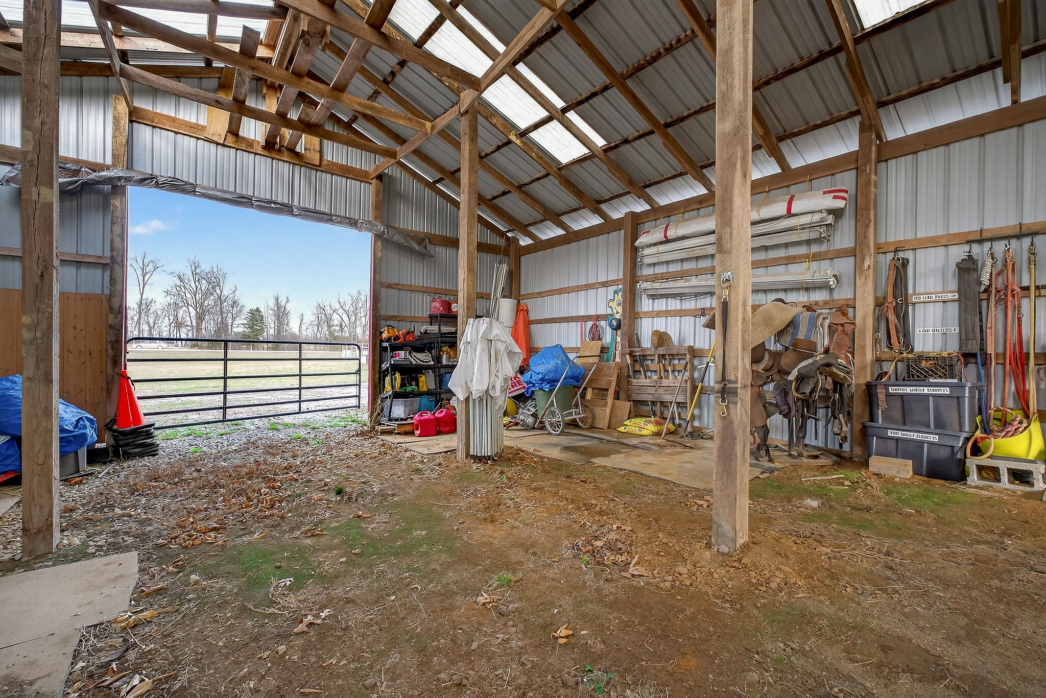 1680 Harrison Ferry Road McMinnville, TN 37110 - Photo 8 of 53 a view of a garage with an bike and a table and chairs