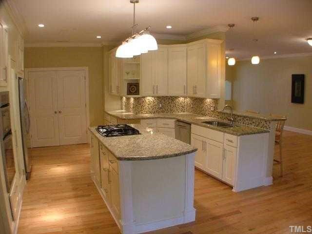 1114 Dogwood Lane Raleigh, NC 27607 - Photo 2 of 9 Fully updated kitchen with stainless appls., granite, center island w/ gas cook top.