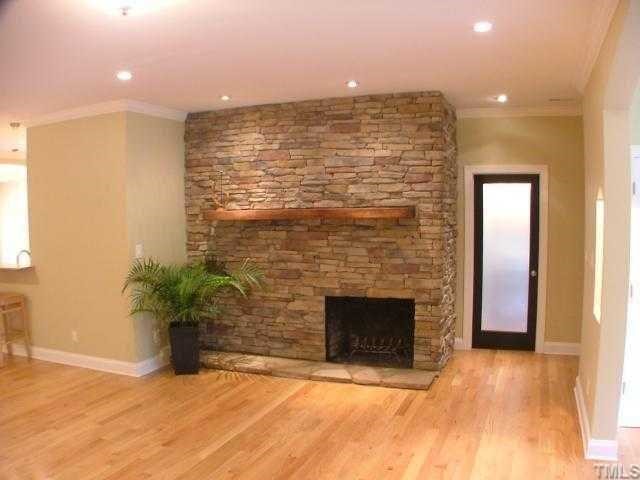 1114 Dogwood Lane Raleigh, NC 27607 - Photo 3 of 9 Beautiful stacked stone fire place can accomodate a flat panel tv install.