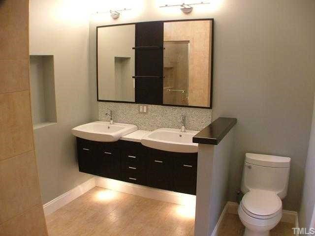 1114 Dogwood Lane Raleigh, NC 27607 - Photo 4 of 9 Very sleek master bath w/ dual vanity, separate tile shower and jacuzzi tub.
