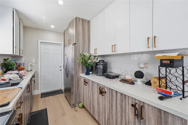 a kitchen with a sink and cabinets