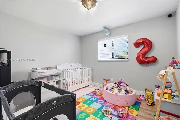 a bedroom with a bed and toys