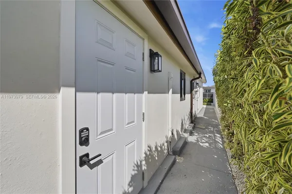 a view of a house with wooden walls