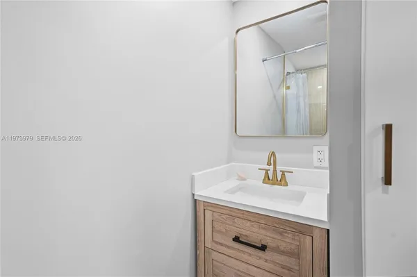 a bathroom with a sink and a mirror