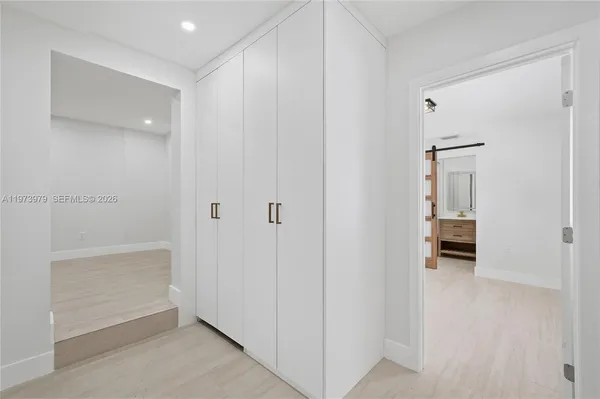 a bathroom with a shower and a sink