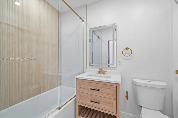 a kitchen with a sink cabinets and stainless steel appliances