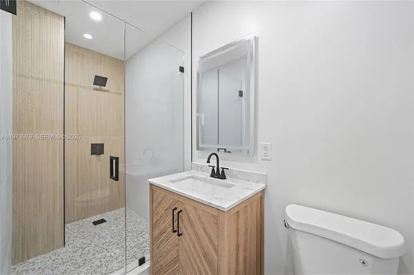 a bathroom with a sink and mirror