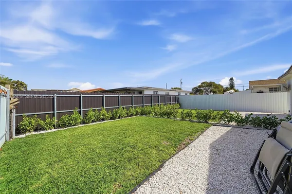 a view of hallway with wooden floor and stairs