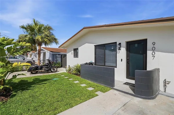 a front view of house with yard patio and green space