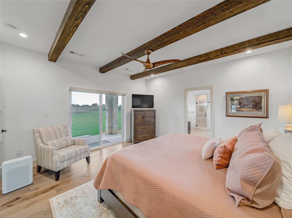 6362 Belz Road Sanger, TX 76266 - Photo 18 of 40 a bed room with a bed and a couch