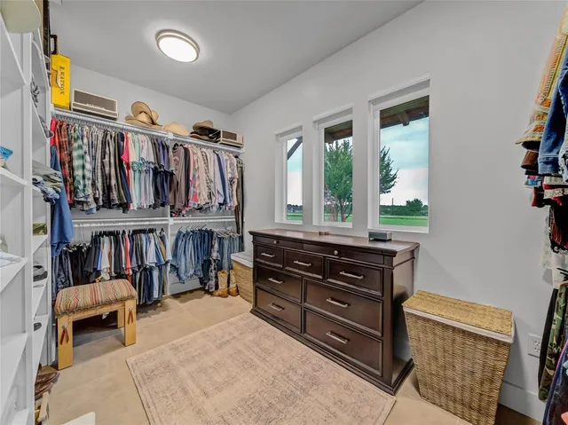 a bed room with a bed and a book shelf