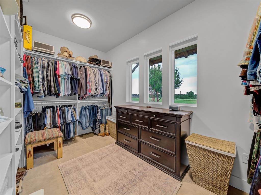 6362 Belz Road Sanger, TX 76266 - Photo 19 of 40 a bed room with a bed and a book shelf