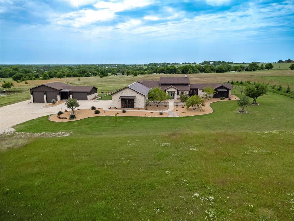 6362 Belz Road Sanger, TX 76266 - Photo 2 of 40 a view of a lake with a yard