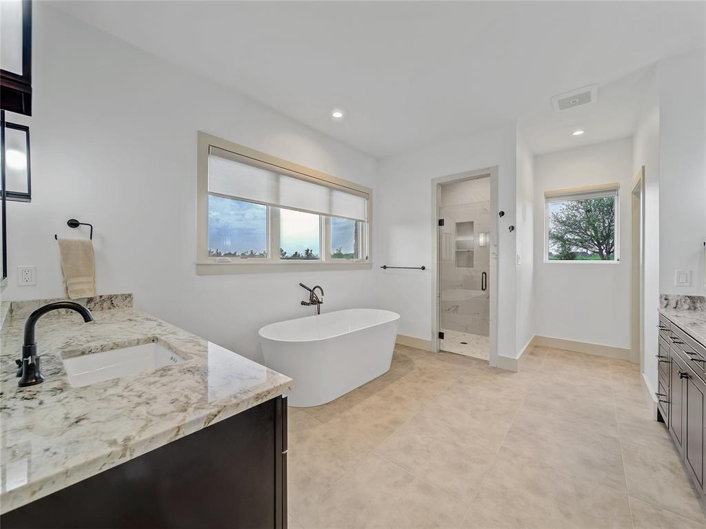 6362 Belz Road Sanger, TX 76266 - Photo 21 of 40 a bathroom with a double vanity sink and mirror
