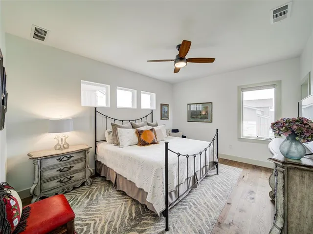 a bedroom with double bed and a window