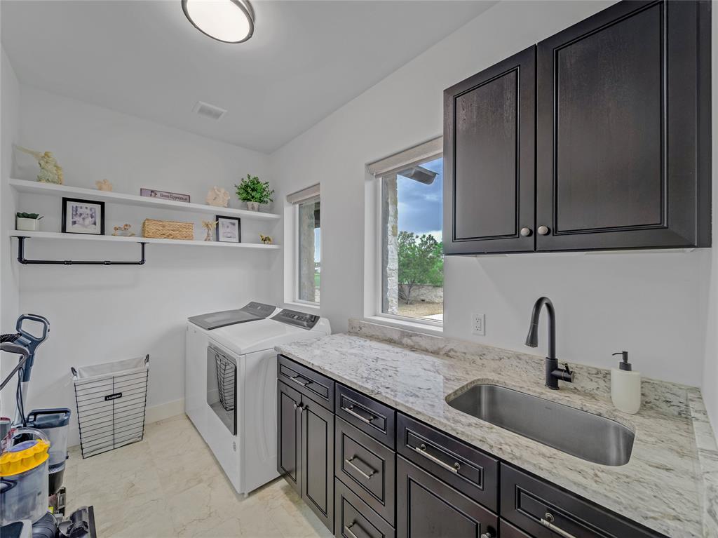 6362 Belz Road Sanger, TX 76266 - Photo 30 of 40 a kitchen with stainless steel appliances granite countertop a sink stove and cabinets