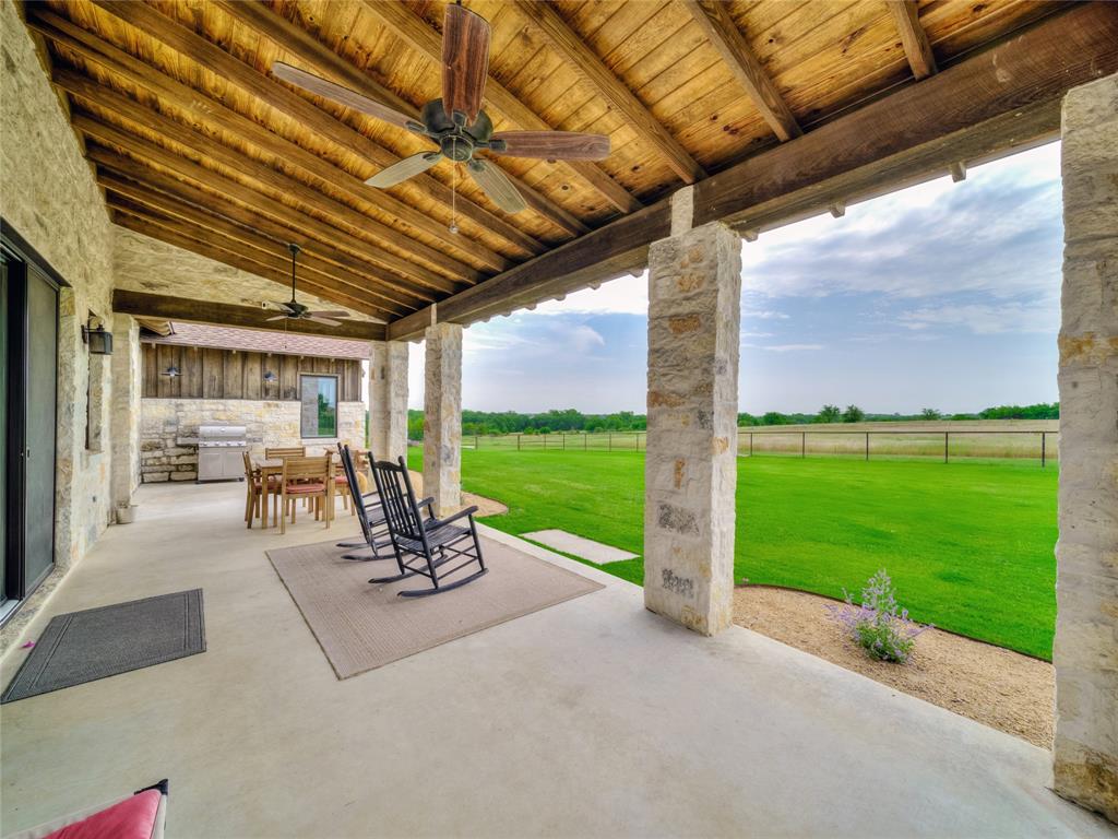 6362 Belz Road Sanger, TX 76266 - Photo 31 of 40 a view of a patio with a table chairs and a patio