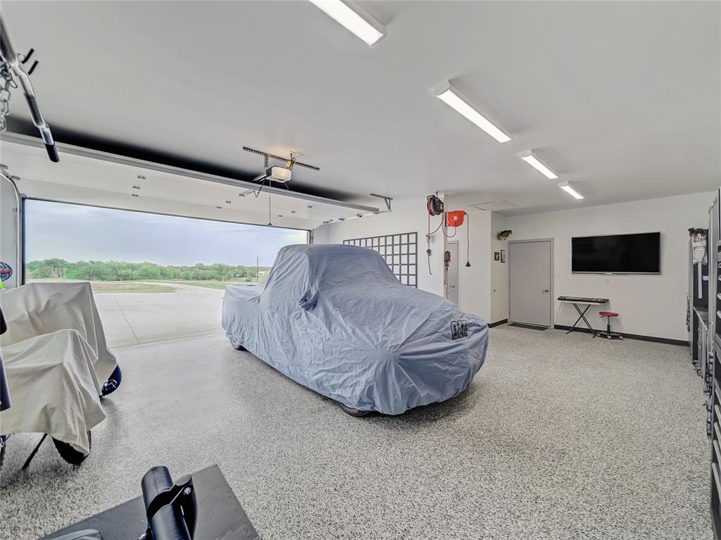 6362 Belz Road Sanger, TX 76266 - Photo 34 of 40 a living room with furniture and a flat screen tv