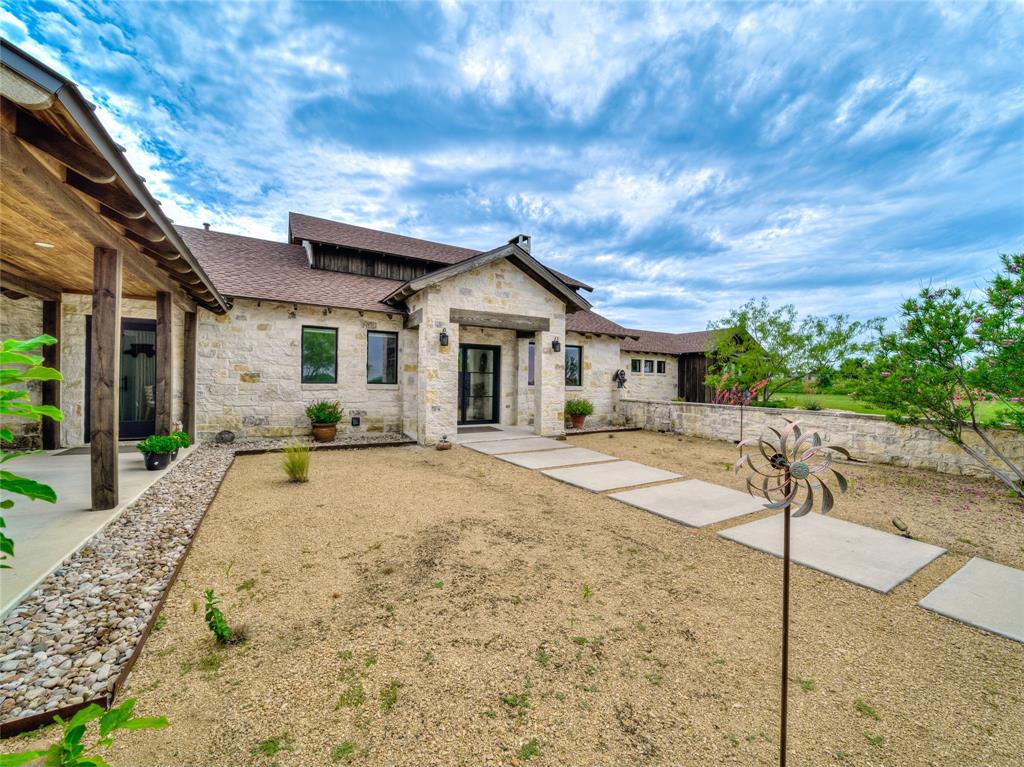 6362 Belz Road Sanger, TX 76266 - Photo 4 of 40 a front view of a house with garden