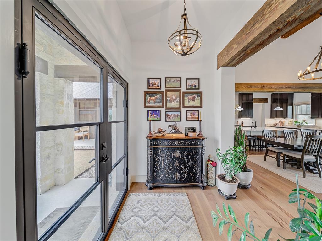 6362 Belz Road Sanger, TX 76266 - Photo 6 of 40 a view of an entryway with wooden floor and a potted plant