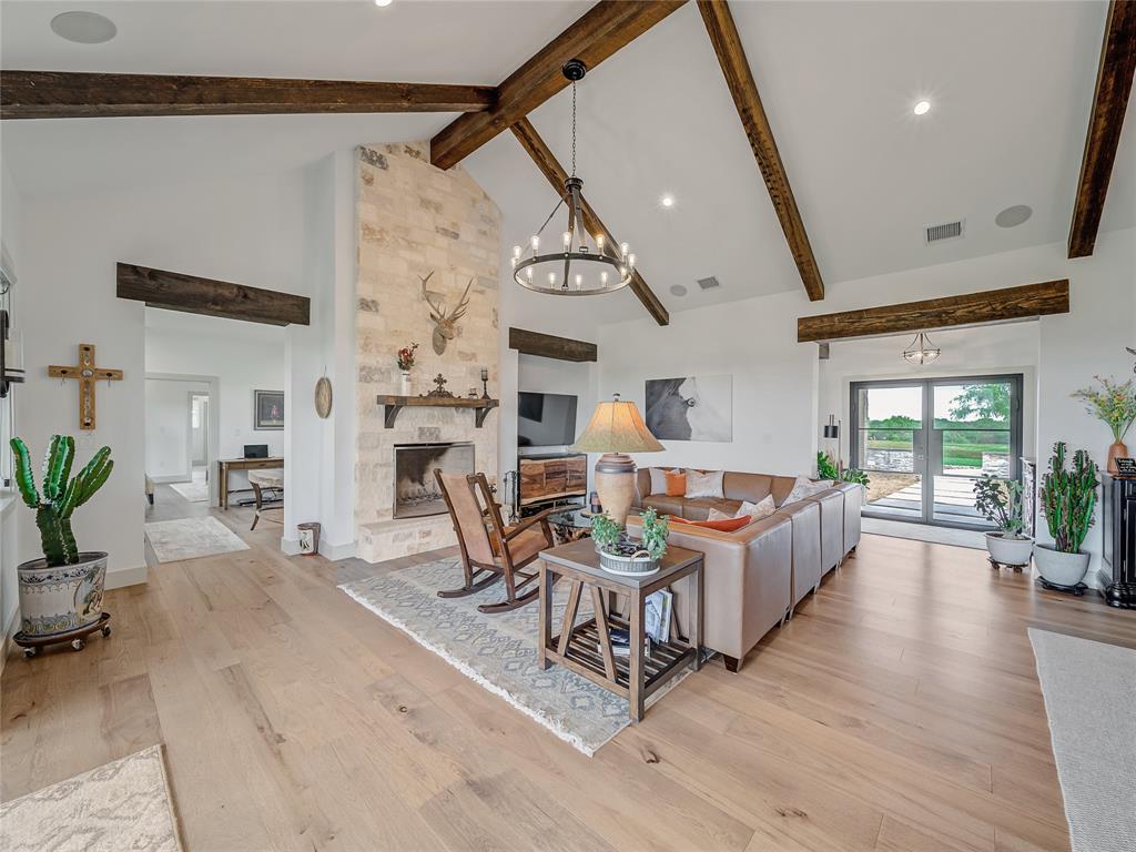6362 Belz Road Sanger, TX 76266 - Photo 7 of 40 a living room with furniture and a fireplace