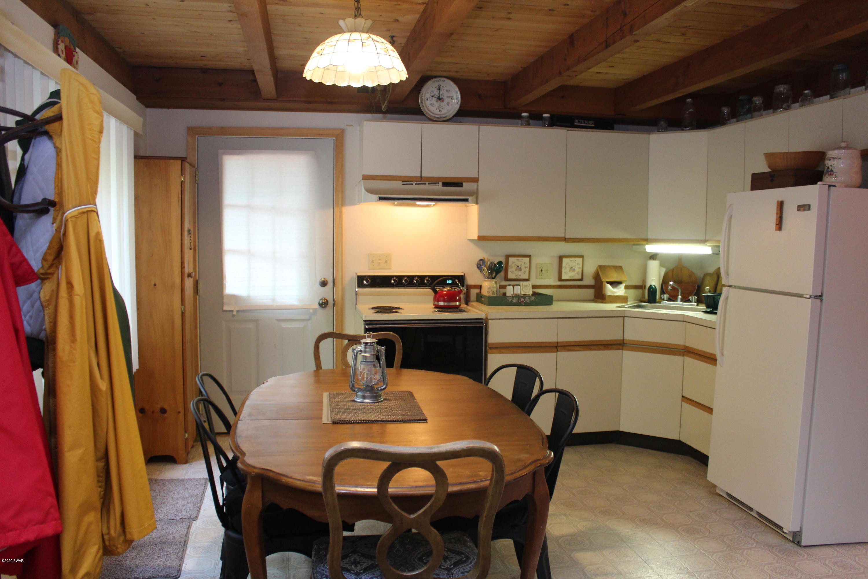 382 Northgate Road Lake Ariel, PA 18436 - Photo 5 of 20 a kitchen with stainless steel appliances granite countertop a dining table chairs refrigerator and sink