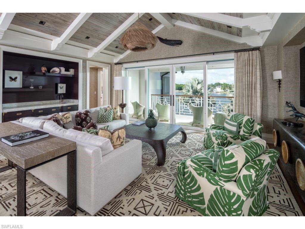 3401 Rum Row Naples, FL 34102 - Photo 11 of 22 a living room with furniture and a large window
