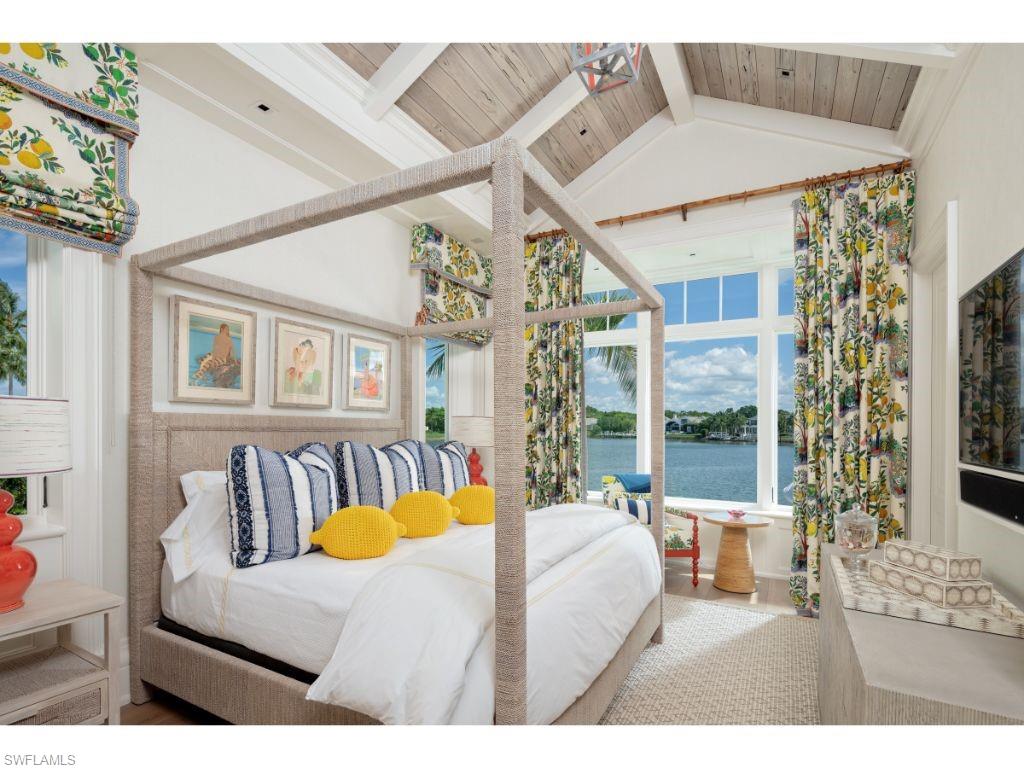3401 Rum Row Naples, FL 34102 - Photo 13 of 22 a bedroom with furniture and a large window