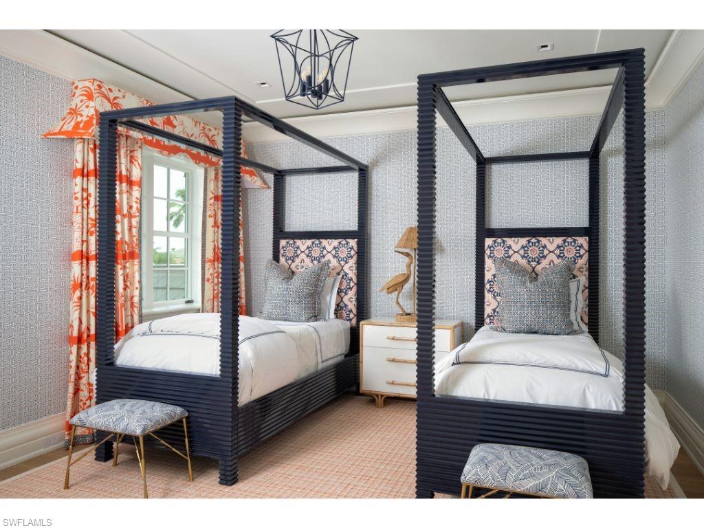 3401 Rum Row Naples, FL 34102 - Photo 15 of 22 a bedroom with a bed lamp and a window