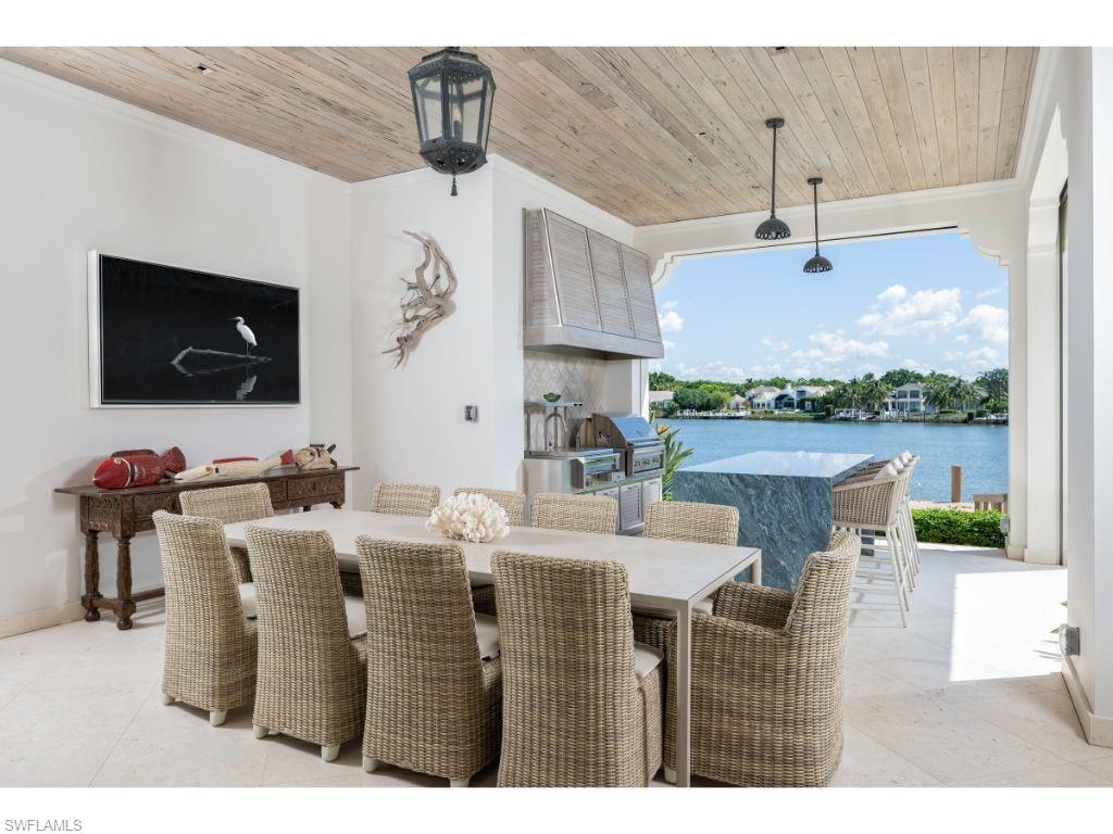 3401 Rum Row Naples, FL 34102 - Photo 18 of 22 a view of a dining room with furniture window and outside view