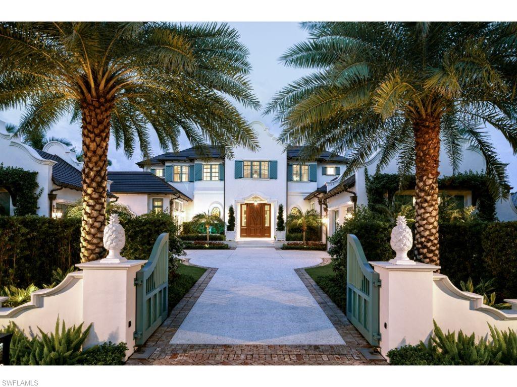 3401 Rum Row Naples, FL 34102 - Photo 2 of 22 a view of a house with a yard and potted plants