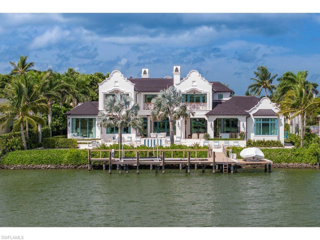 3401 Rum Row Naples, FL 34102 - Photo 22 of 22 a front view of house with yard space and lake view