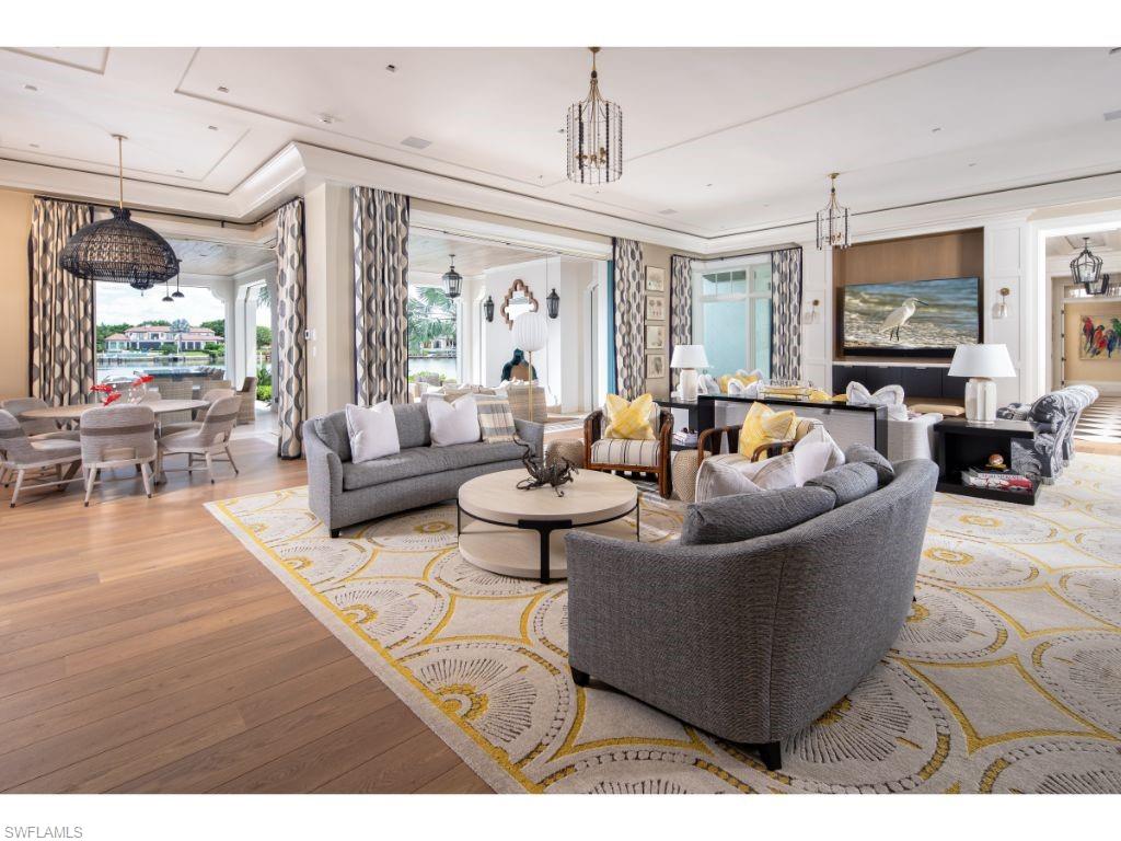 3401 Rum Row Naples, FL 34102 - Photo 5 of 22 a living room with furniture and a flat screen tv