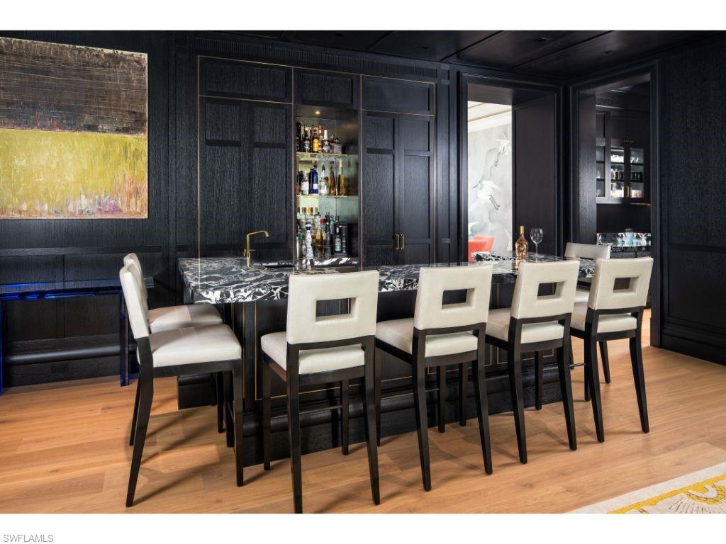 3401 Rum Row Naples, FL 34102 - Photo 7 of 22 a view of a dining room with furniture