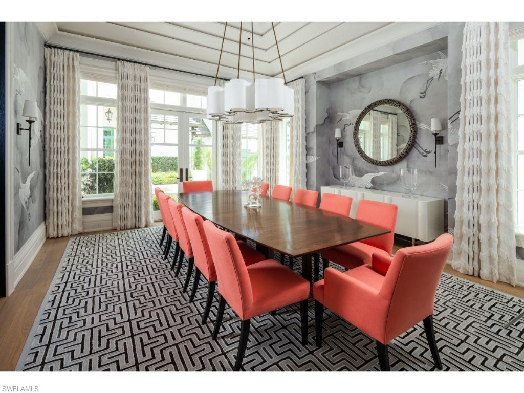 3401 Rum Row Naples, FL 34102 - Photo 8 of 22 a view of a dining room with furniture and a large window