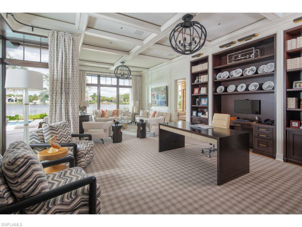 3401 Rum Row Naples, FL 34102 - Photo 9 of 22 a living room with furniture a rug and a chandelier