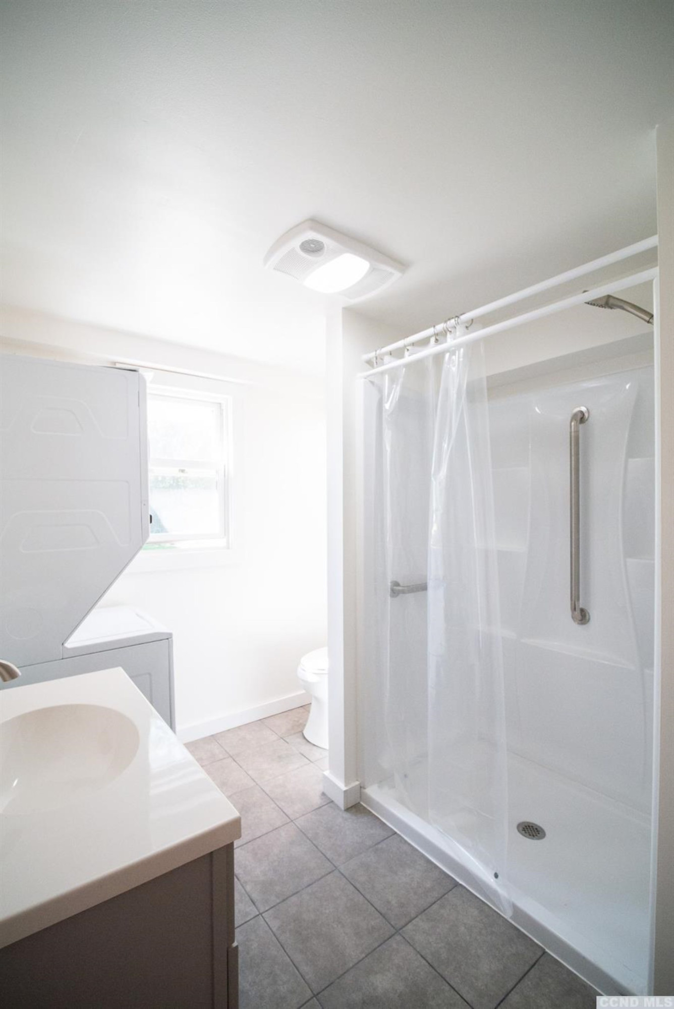 111 Camp Winsoki Road Rensselaerville, NY 12147 - Photo 19 of 22 Bright bathroom with stackable laundry