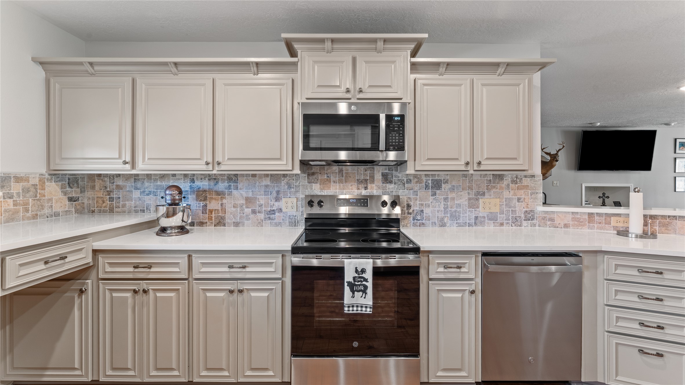 245 Alabama Point Livingston, TX 77351 - Photo 13 of 50 a kitchen with stainless steel appliances granite countertop a stove sink and cabinets