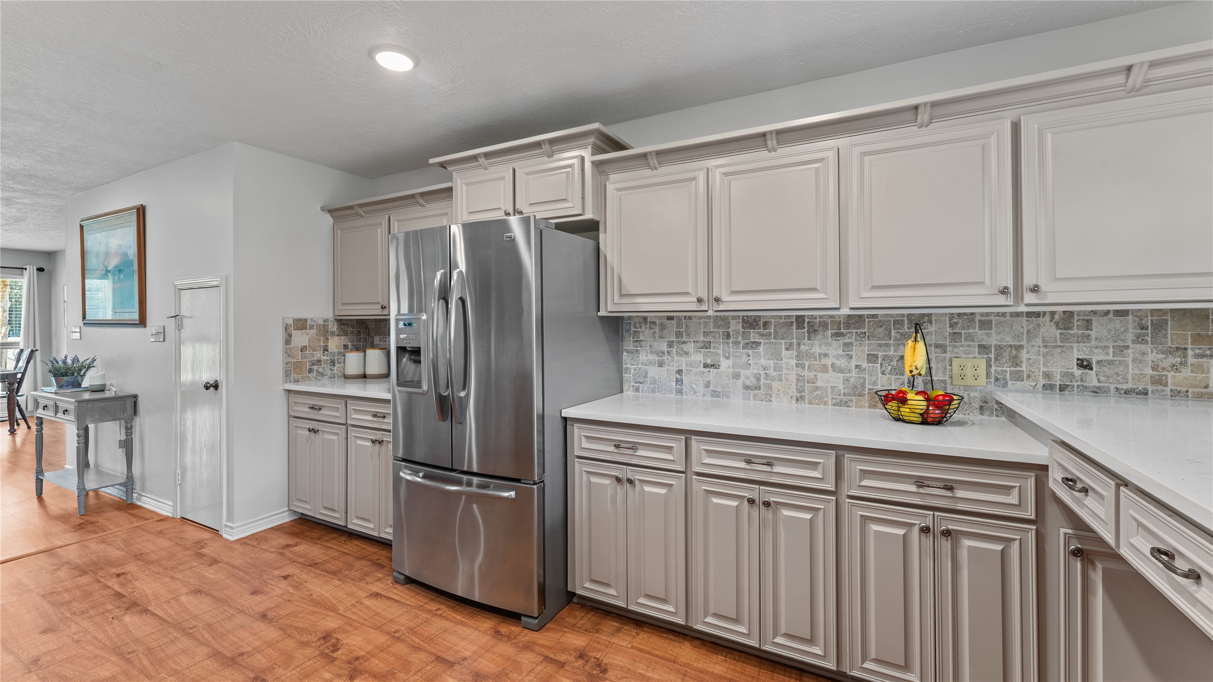 245 Alabama Point Livingston, TX 77351 - Photo 14 of 50 a kitchen with stainless steel appliances granite countertop a refrigerator sink and cabinets