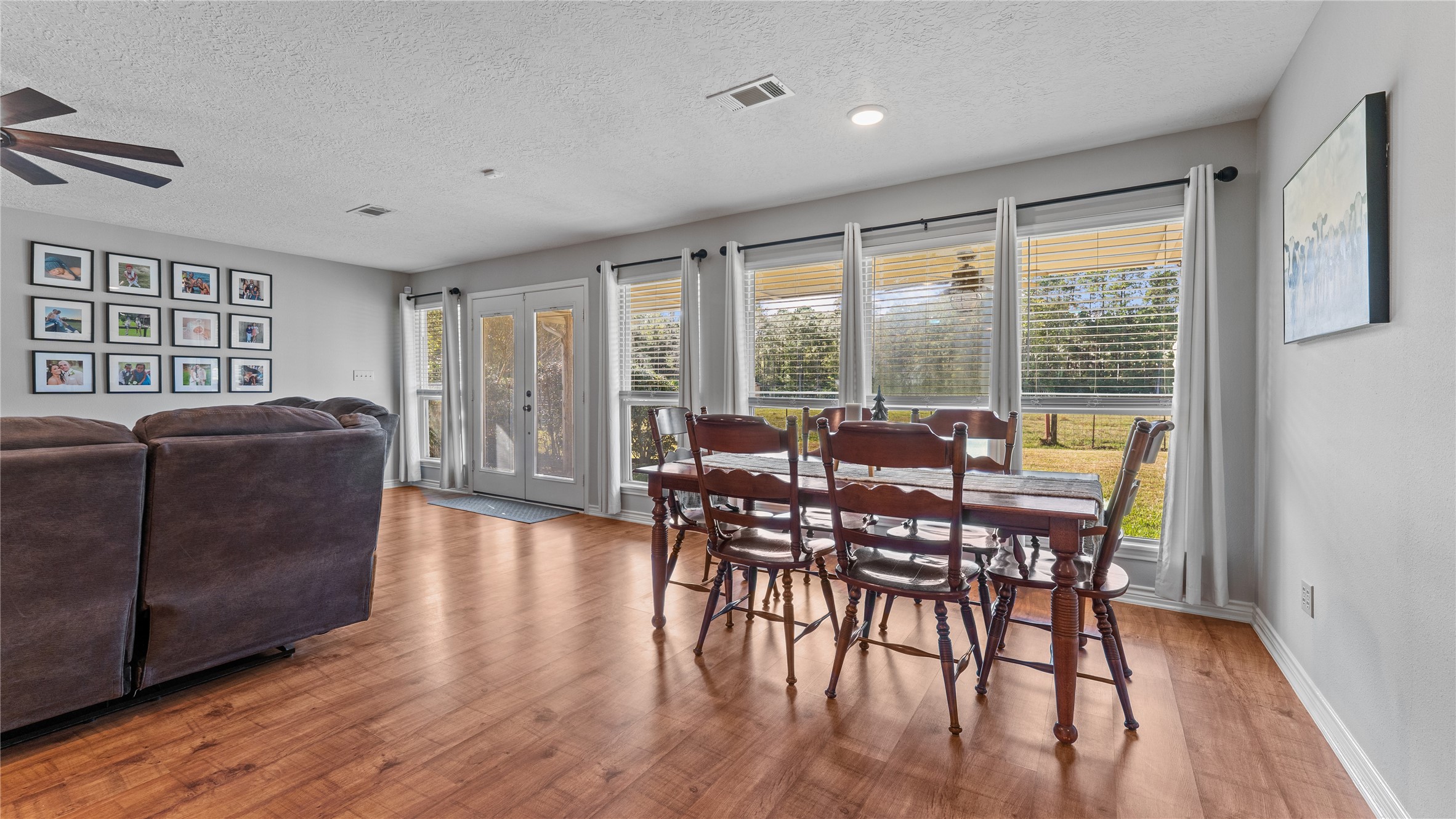 245 Alabama Point Livingston, TX 77351 - Photo 16 of 50 a view of a dining room with furniture window and wooden floor