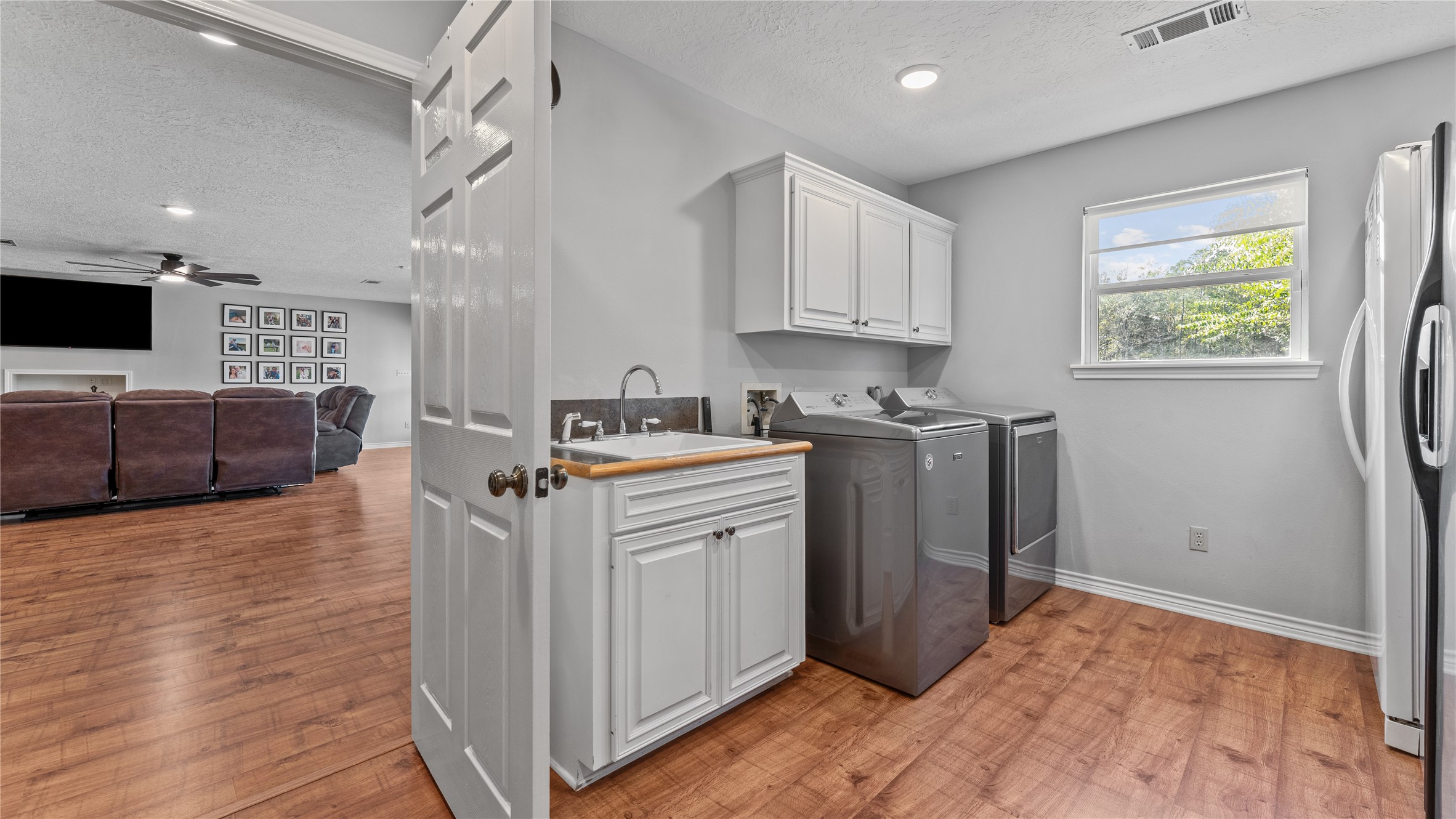 245 Alabama Point Livingston, TX 77351 - Photo 18 of 50 a view of kitchen with stainless steel appliances granite countertop a stove top oven a sink dishwasher and a refrigerator with wooden floor