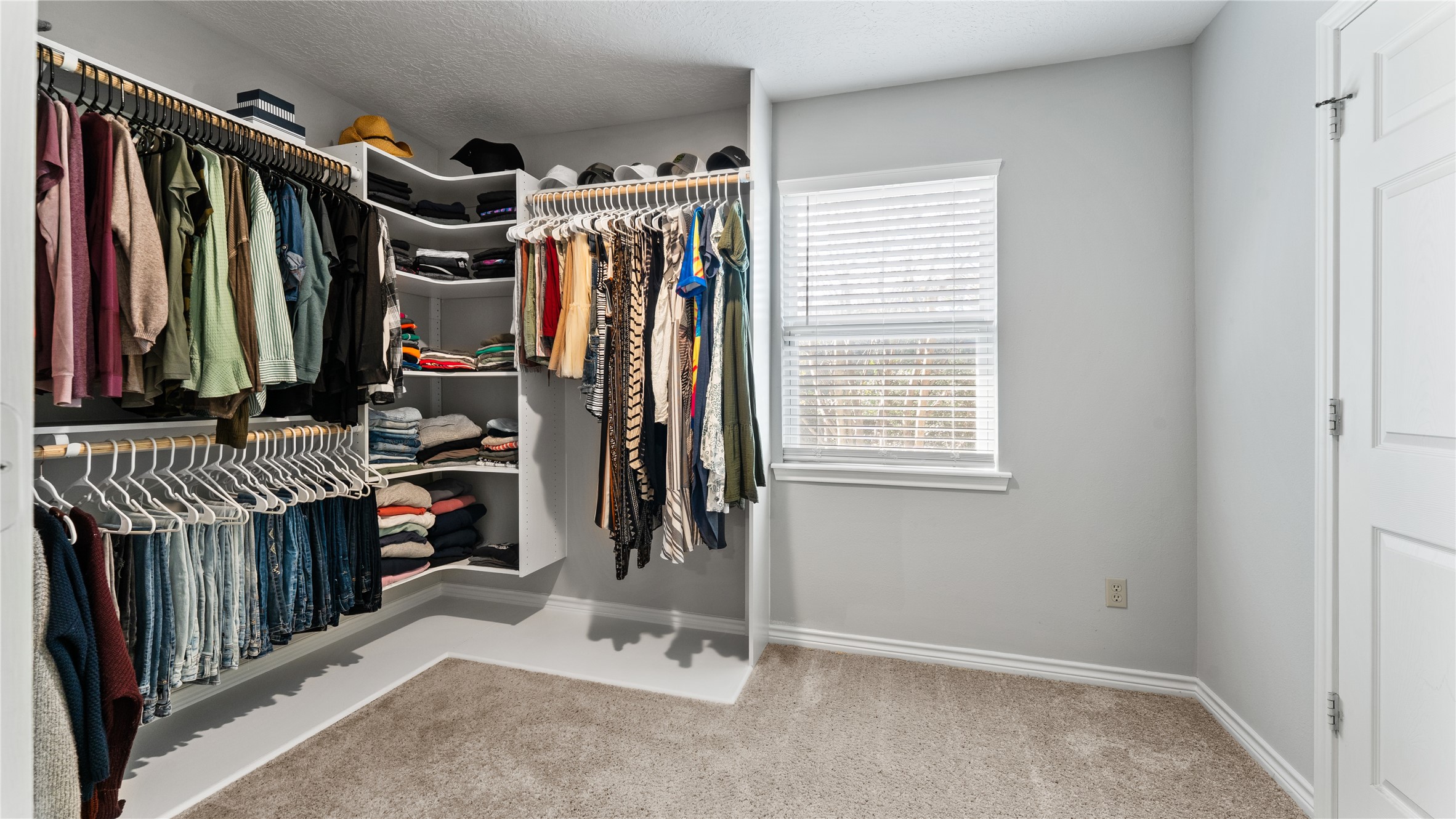 245 Alabama Point Livingston, TX 77351 - Photo 26 of 50 a view of walk in closet with clothes