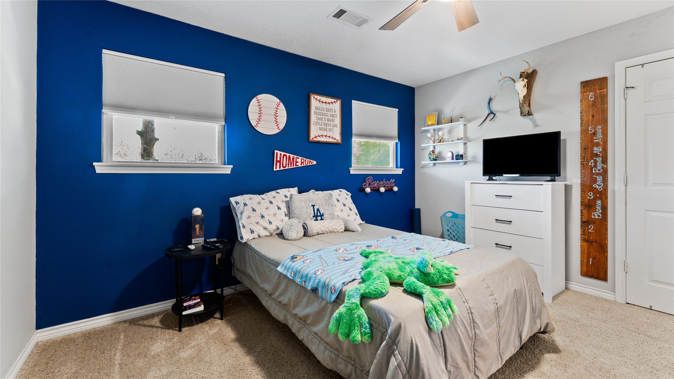 245 Alabama Point Livingston, TX 77351 - Photo 29 of 50 a bedroom with a bed and a flat screen tv